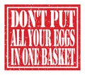 DON`T PUT ALL YOUR EGGS IN ONE BASKET, text written on red stamp sign Royalty Free Stock Photo