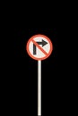 Don`t right arrow with red edge circular badge with old rusted iron pole. Traffic sign signage. isolated with black background Royalty Free Stock Photo