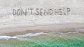 Don`t send help written on exotic beach and blue tropic sea