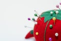 Half of a pin cushion and needles - a tomato Royalty Free Stock Photo