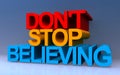 don\'t stop believing on blue Royalty Free Stock Photo