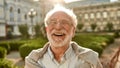 Don`t stop laughing! Portrait of happy and handsome senior man in glasses looking at camera and smiling while standing Royalty Free Stock Photo