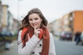 Don`t tell anyone, it`s our secret. Woman cheerful asking for secrecy, silence isolated un focused blurred city on background Royalty Free Stock Photo