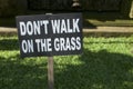 `don`t walk on the grass` signage Royalty Free Stock Photo