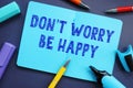 Don`t Worry Be Happy inscription on the piece of paper