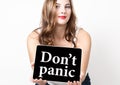 Don't panic written on virtual screen. technology, internet and networking concept. beautiful woman with bare shoulders Royalty Free Stock Photo