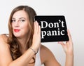 Don't panic written on virtual screen. technology, internet and networking concept. beautiful woman with bare shoulders Royalty Free Stock Photo