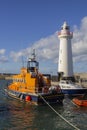 Donaghadee Lightouse and boats moored in Donaghadee Harbour Royalty Free Stock Photo