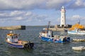 Donaghadee Lightouse and boats moored in Donaghadee Harbour Royalty Free Stock Photo