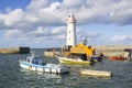 Donaghadee Lightouse and boats moored in Donaghadee Harbour Royalty Free Stock Photo