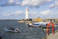 Donaghadee Lightouse and boats moored in Donaghadee Harbour Royalty Free Stock Photo