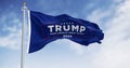 Donald Trump election campaign flag waving on a clear day