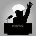 Donald Trump the Tribune a silhouette an icon for interview, hand up. speaker of press conference. The microphone on light bac
