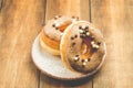 Donat. Donat in a white bowl on a wooden background. Closup