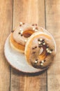Donat. Donat in a white bowl on a wooden background. Top view