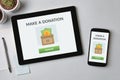 Donate concept on tablet and smartphone screen Royalty Free Stock Photo
