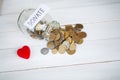 Donate conception. Jar with money on white wood background Royalty Free Stock Photo