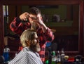 Donate hair. Sharp object near face and squirming distracts person holding it. Donation and charity concept. Guy with Royalty Free Stock Photo