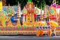 Donate money to help the temple in The Annual Orange parade festival or Chak Phra Festival which took place at Southern Thailand