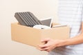 Donate technology to charity. Volunteer hands holding cardboard box with text old used laptop computers, phone, tablet Royalty Free Stock Photo