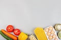 Donation bag with various food on gray background with copy space. Flat lay. top view, Mockup. Food donations or food delivery Royalty Free Stock Photo