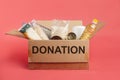 Donation box with food isolated on red background Royalty Free Stock Photo