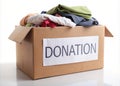 Donation box packed with various clothes and goods, symbolizing support and contribution for charity Royalty Free Stock Photo