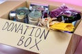 Donation carton box with food pasta, cans, beans and other. Volunteering and social assistance, charity concept.
