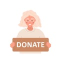 Donation and charity concept. Elderly volunteer woman holding in hands cardboard sign Donate. Support for homeless and