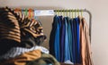 Donation Concept. Separated Used Old Clothes from Wardrobe Rack to Keep and Donate Royalty Free Stock Photo