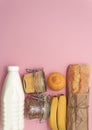 Corn, buckwheat, bananas, milk, bread in white bag on blue background