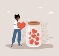 Donation glass jar with red hearts. African woman throw heart in huge bottle for donate. Give and share your love Royalty Free Stock Photo