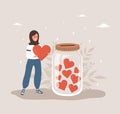 Donation glass jar with red hearts. Arabian woman throw heart in huge bottle for donate. Give and share your love Royalty Free Stock Photo
