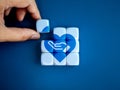 Donation and helping, hand receive and blue heart icon assemble together on white cube blocks.