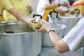 Hands of the poor receive food from the donor`s share. poverty concept Royalty Free Stock Photo