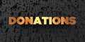 Donations - Gold text on black background - 3D rendered royalty free stock picture