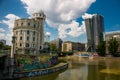 Donaukanal - Danube Canal of Vienna, Austria. At the right the new UNIQA-Tower and opposite the historic building Urania, a public Royalty Free Stock Photo