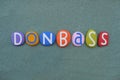 Donbass, historical region in south-eastern Ukraine composed with multi colored stone letters