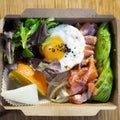 Donburi Salmon served in a Japanese restaurant in Tokyo . Japanese combo dish with chicken, rice, egg, and vegetables.