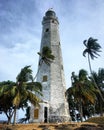 Dondra Head Lighthouse among the palm trees on the southernmost point in Sri Lanka, Devinuwara, Southern Province, Sri Lanka Royalty Free Stock Photo