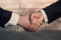 Done deal between two business people sealed with a handshake Royalty Free Stock Photo