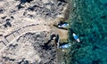 Done view of unrecognized people kayaking in the sea. People active, healthy lifestyle