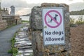 Donegal Town, Ireland - October 23 2021 : Sign telling that no dogs are allowed at the abbey graveyard