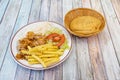 Doner kebab menu with chopped grilled chicken meat, French fries, side of white rice and iceberg lettuce Royalty Free Stock Photo