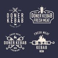 Doner Kebab vintage logo set. Kebab, Shawarma logo with skewer and fire isolated on black background.