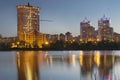 Donetsk City downtown skyline at dusk with skyscrapers illuminated over Kalmius river