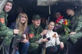 Donetsk - May, 9, 2015: Soldiers parade participants and residents of the city are photographed together