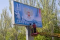 Donetsk, Ukraine - April 29, 2017: Workers glue Banner in the process of preparing for the celebration of the Day of Donetsk Peopl