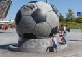 Donetsk, Ukraine - August 22, 2015: Children playing near the fountain stadium Donbass Arena