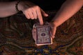 DONETSK, UKRAINE - JUNE 10, 2021: Close up female hands holding tarot cards. Fortuneteller. Witchcraft. Royalty Free Stock Photo